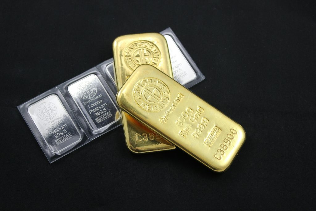 Close-up of gold and platinum bars depicting wealth and investment potential.